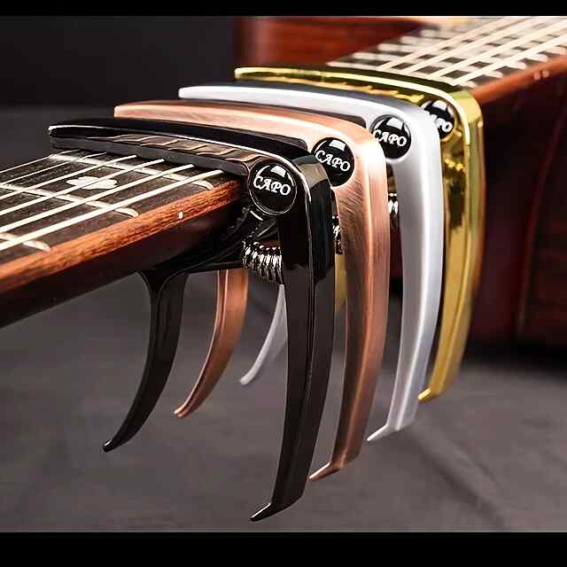 Каподастр для гітари, універсальний, чорний, зручний у використанні. - 1 фото товару