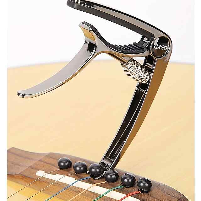 Каподастр для гітари, універсальний, чорний, зручний у використанні. - 2 фото товару