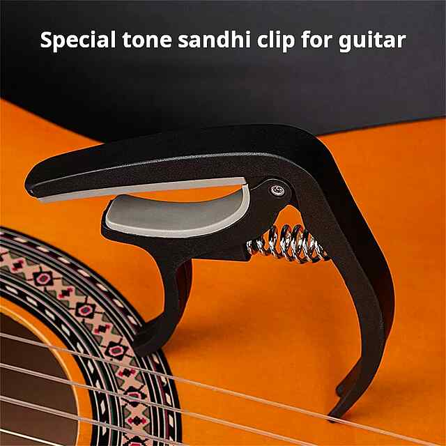 Каподастр для гітари - універсальний та зручний аксесуар. Чорний АБС-пластик, компактний, підійде до більшості грифів. Купити Україна. - 1 фото товару