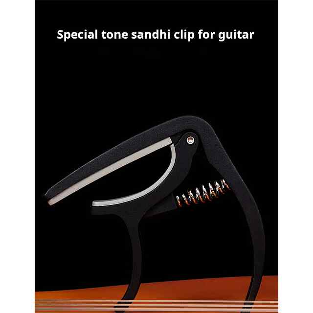 Каподастр для гітари - універсальний та зручний аксесуар. Чорний АБС-пластик, компактний, підійде до більшості грифів. Купити Україна. - 3 фото товару