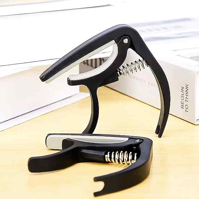 Каподастр для гітари – Зміна тональності, компактний та легкий. Чорний ABS-пластик, універсальний, зручний. Доставка по Україні.