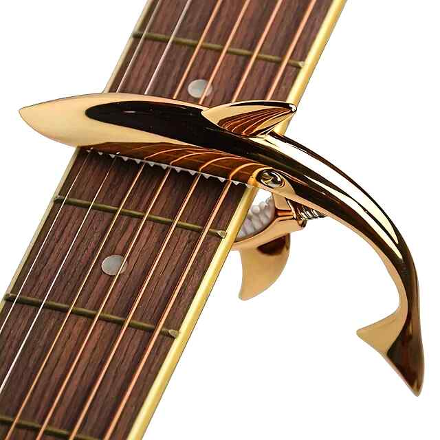 Каподастр гітарний, універсальний для акустичних та електрогітар. Срібне забарвлення, силікон, алюміній. З мішком. - 1 фото товару